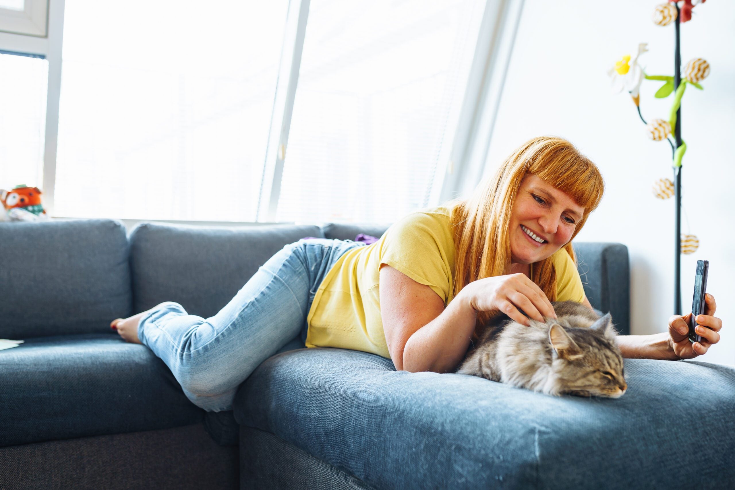 A woman hanging out with her emotional support animal cat in Michigan.