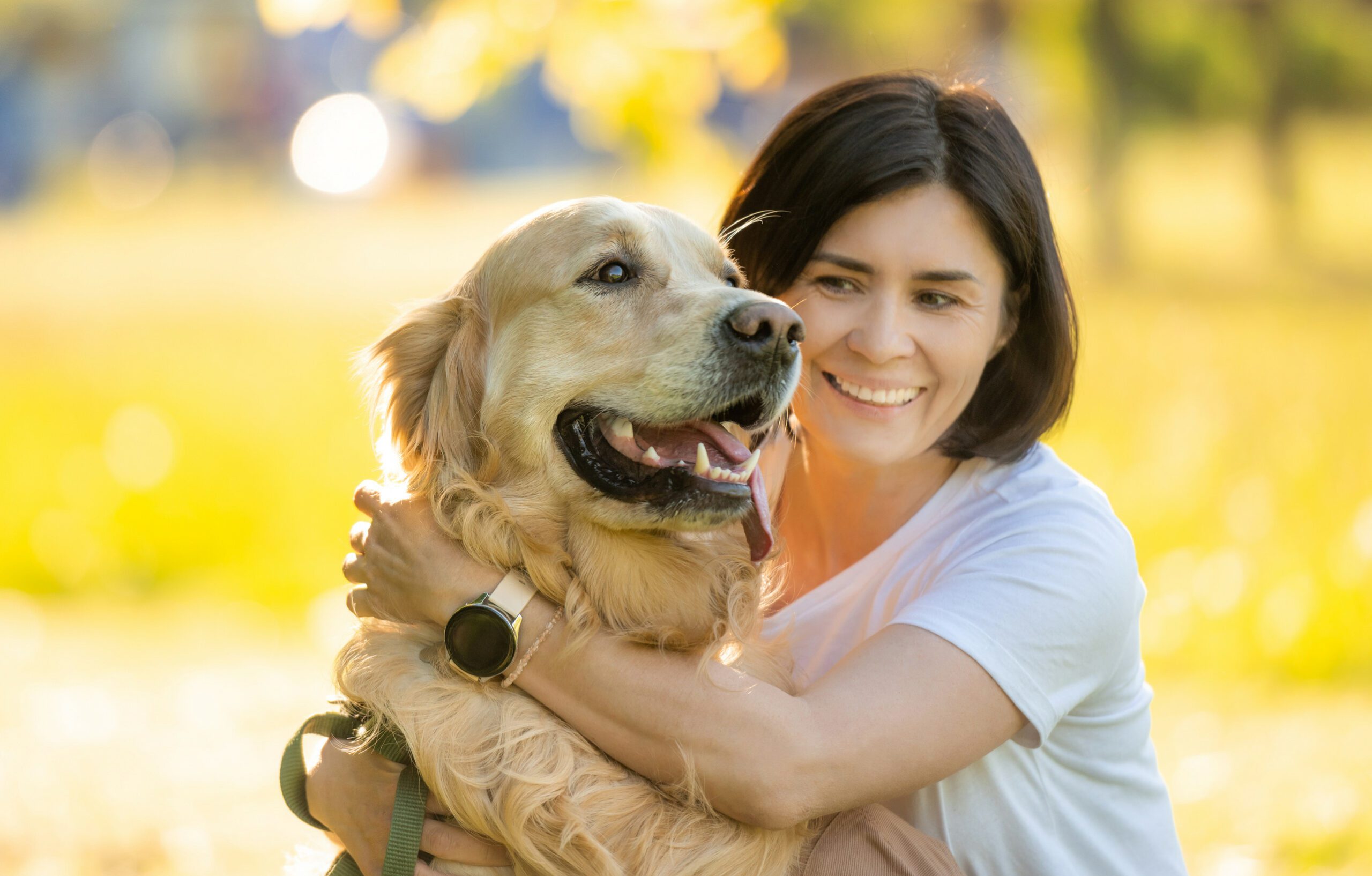 Owner hugging an emotional support animal that follows Iowa laws with a valid ESA letter.