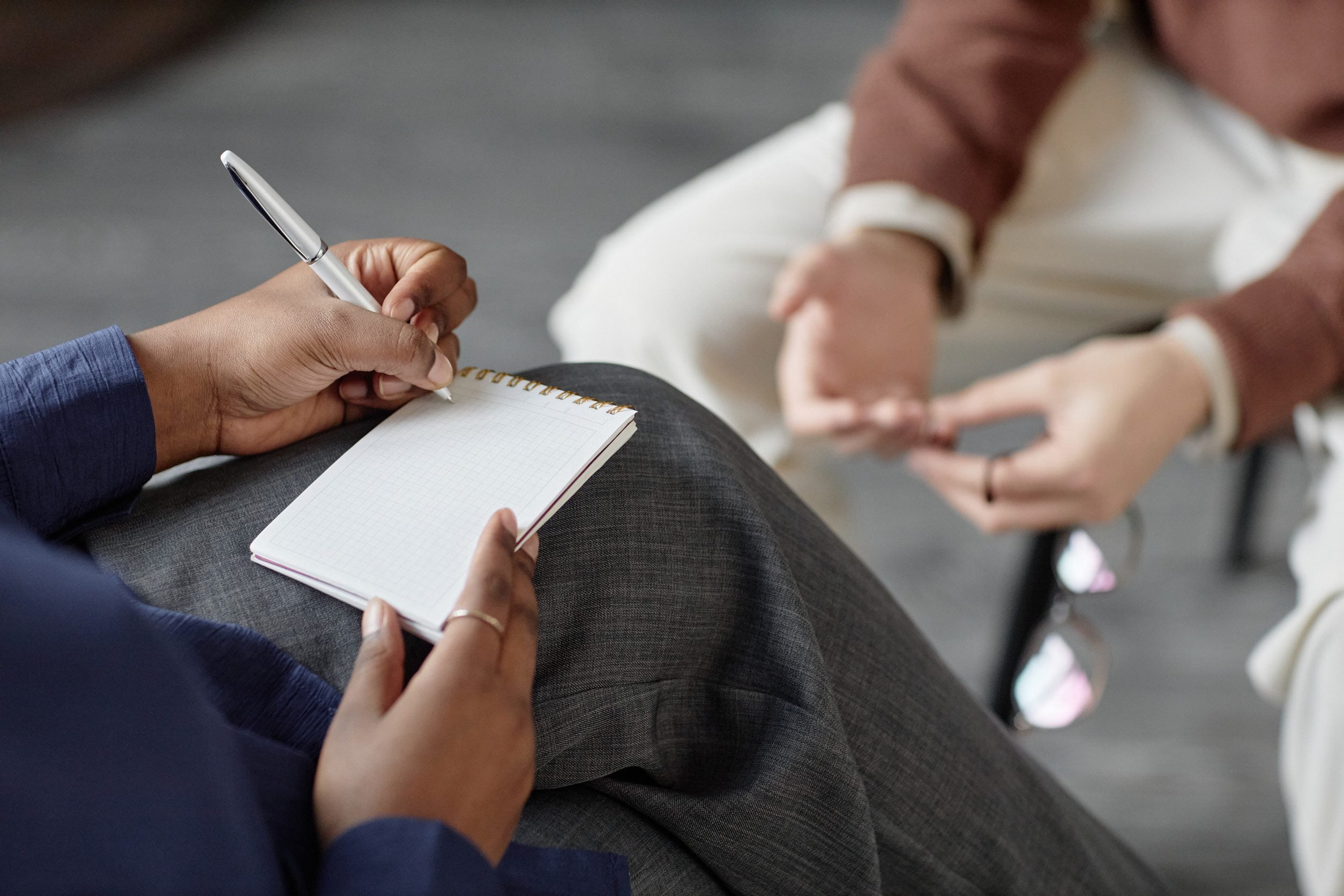 A therapist in Austin taking notes before writing an ESA letter.
