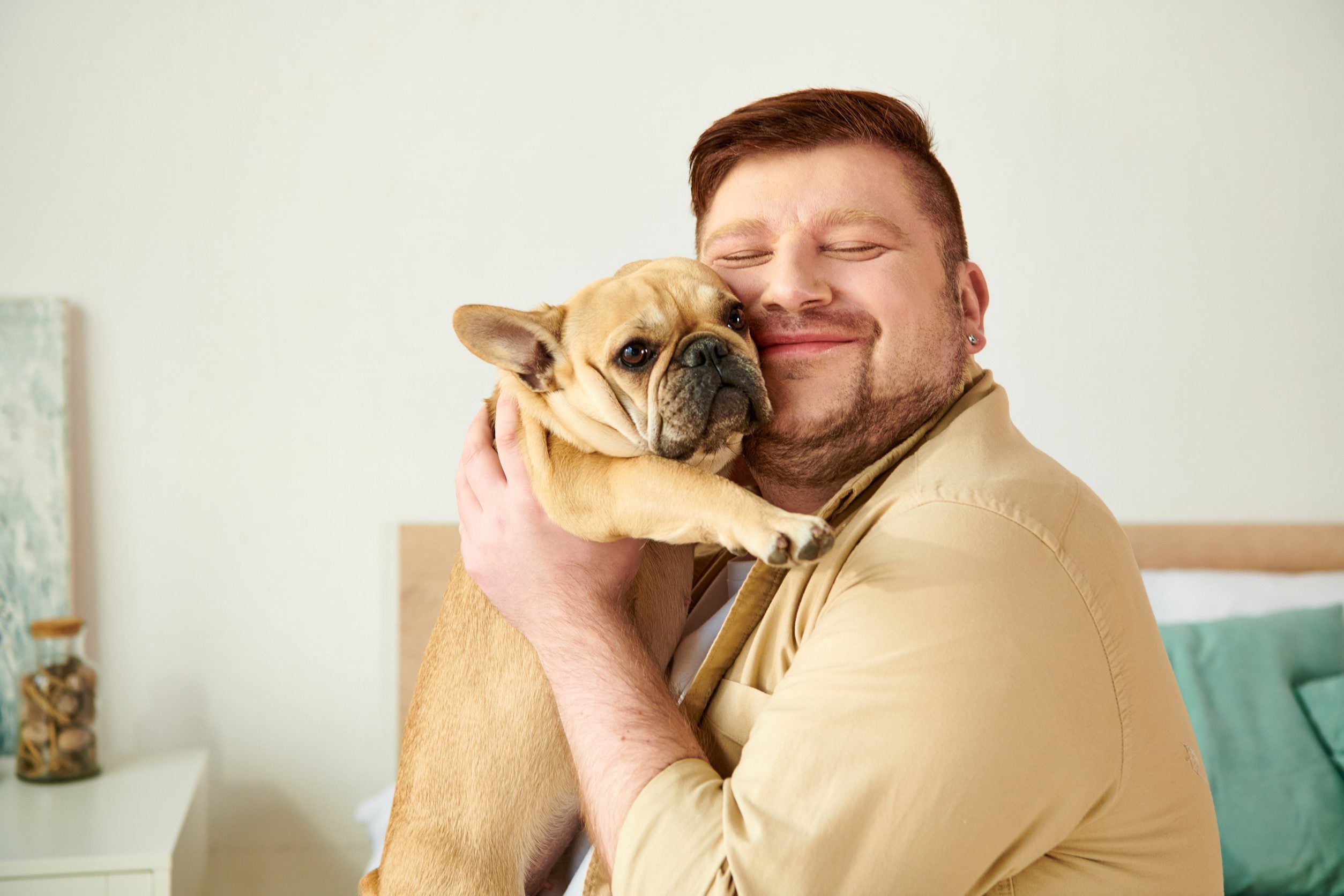 A man holding a small emotional support animal in Little Rock.