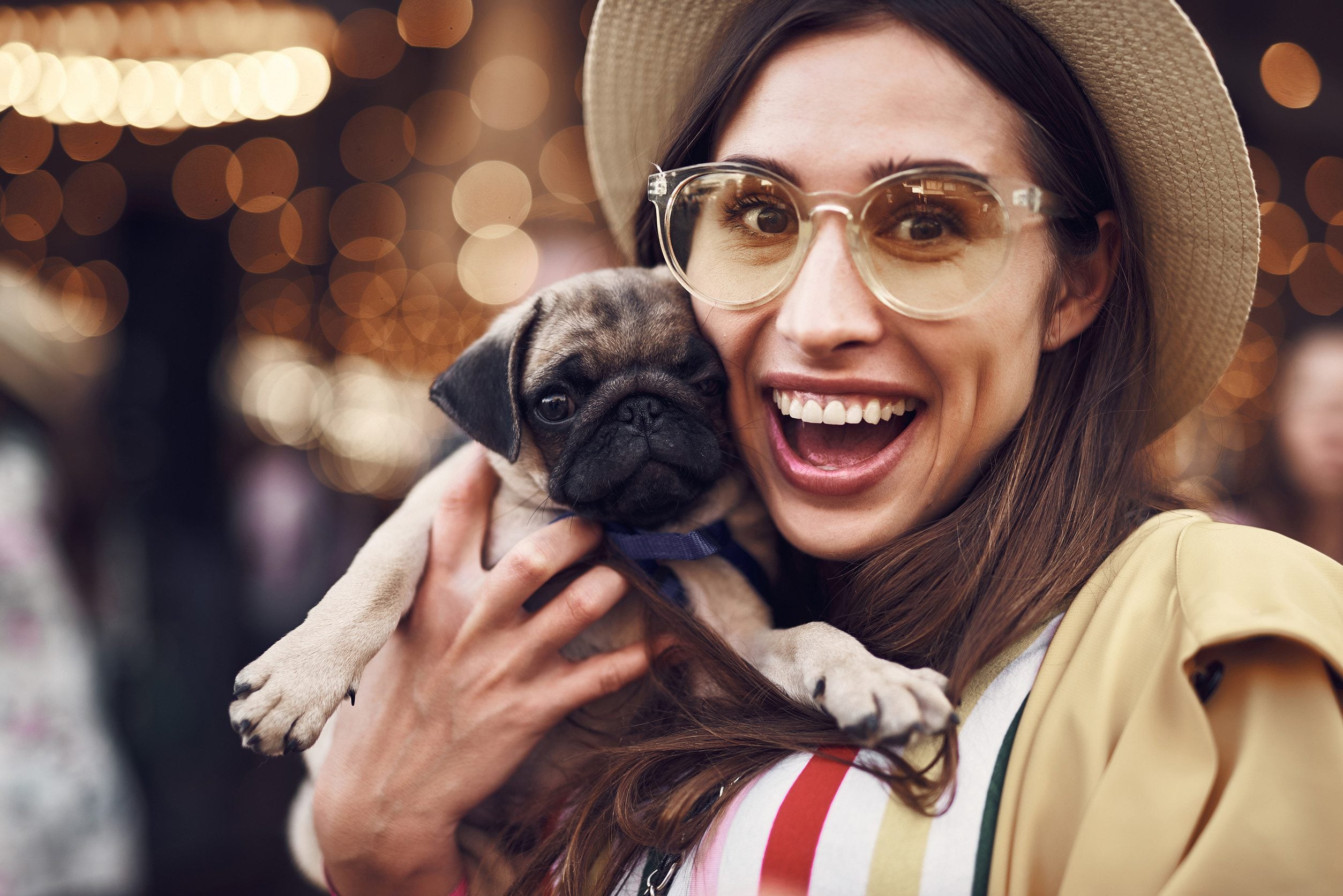 A woman taking a selfie with her emotional support animal in Newark, DE.