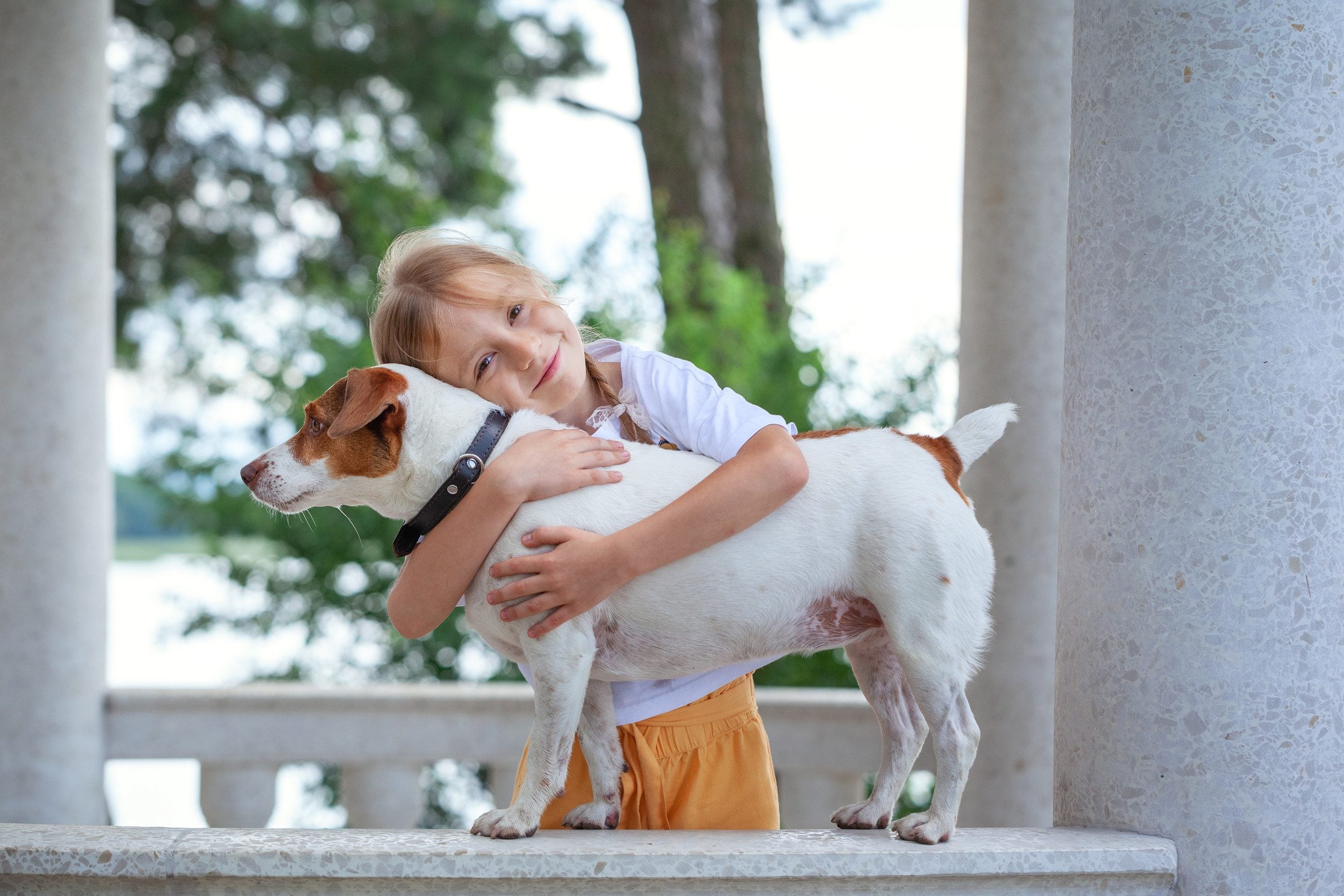 A girl hugging her emotional support animal in Savannah, GA.