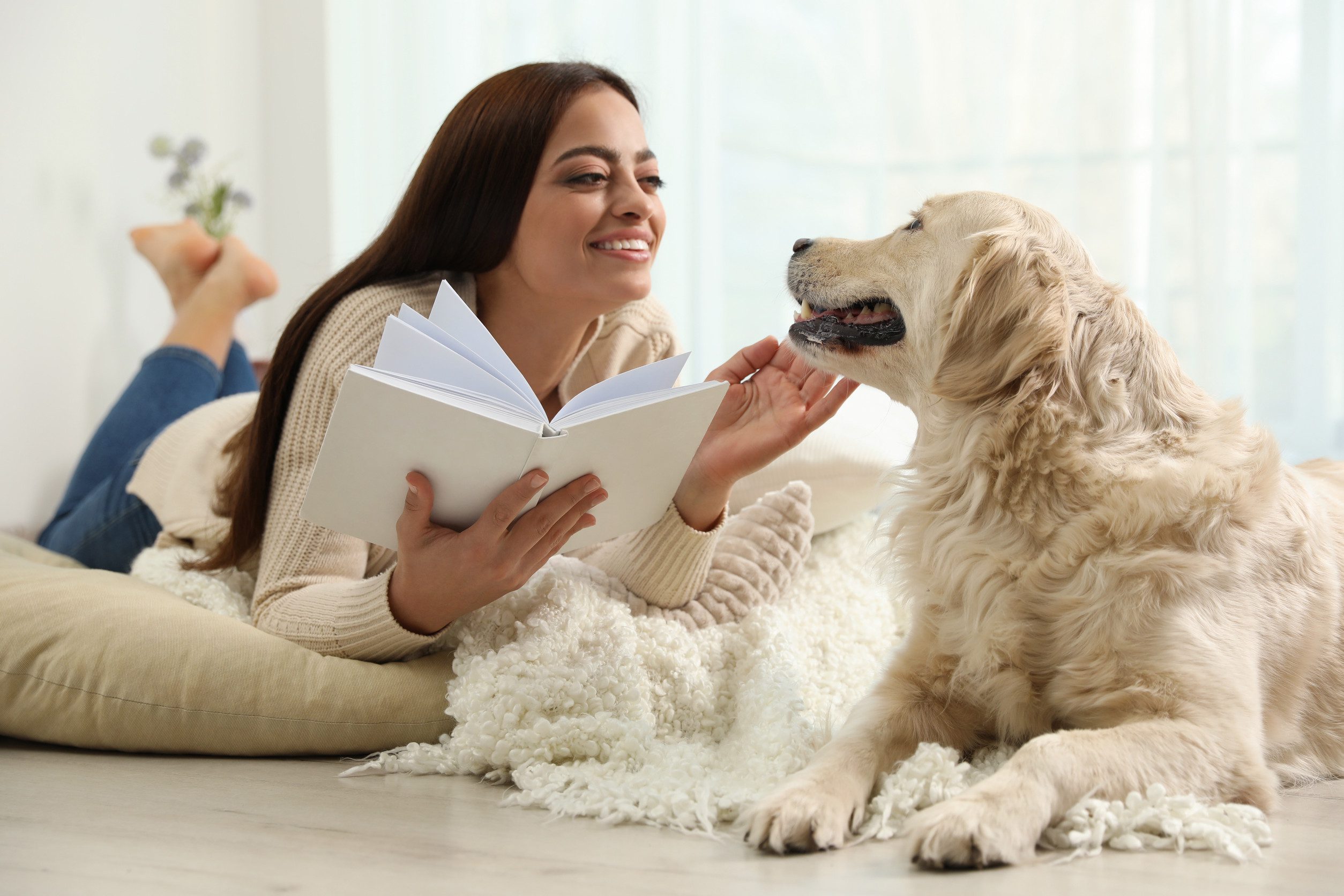 A woman spending time with her support dog after learning how to get an emotional support animal (ESA) letter in Rockville.
