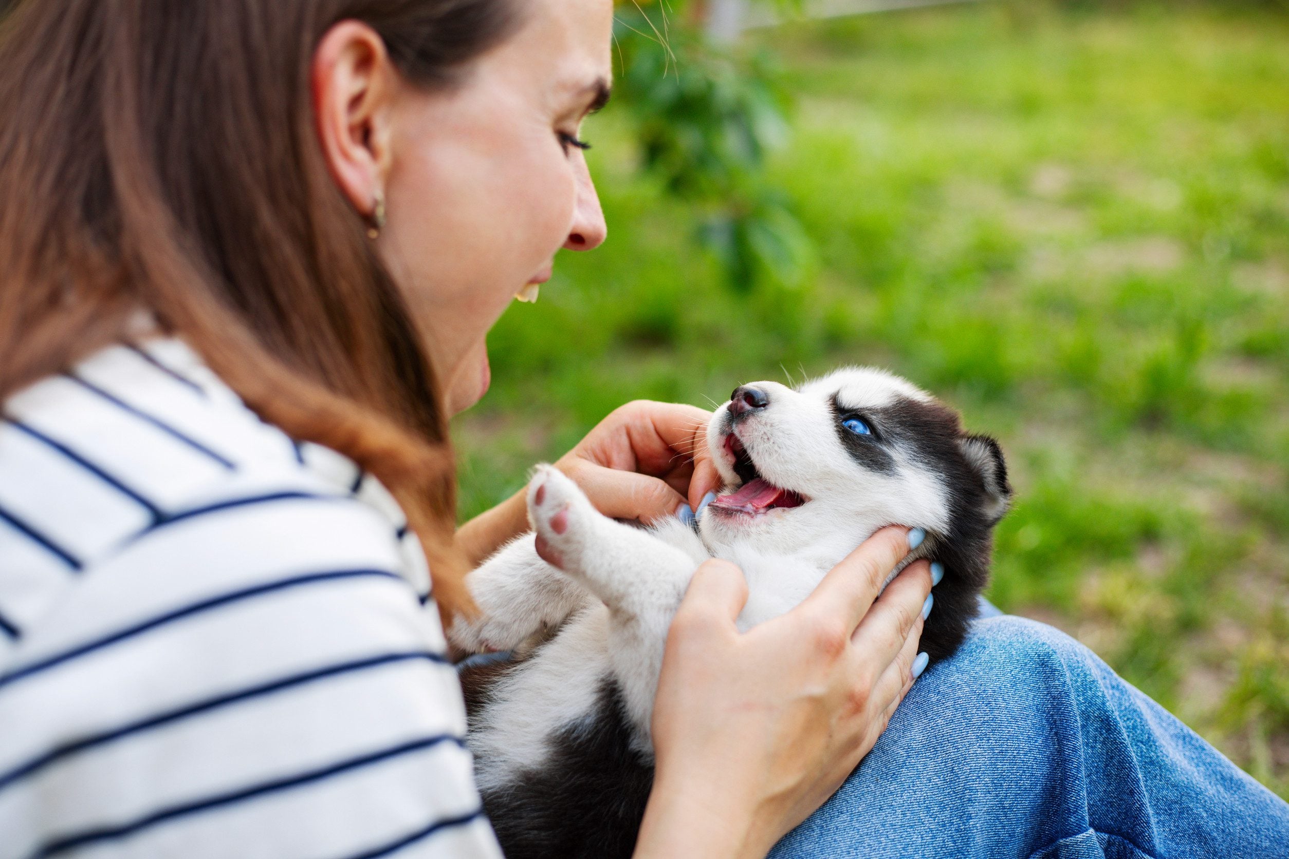 A woman playing with her emotional support animal after getting an ESA letter in Columbus, GA.