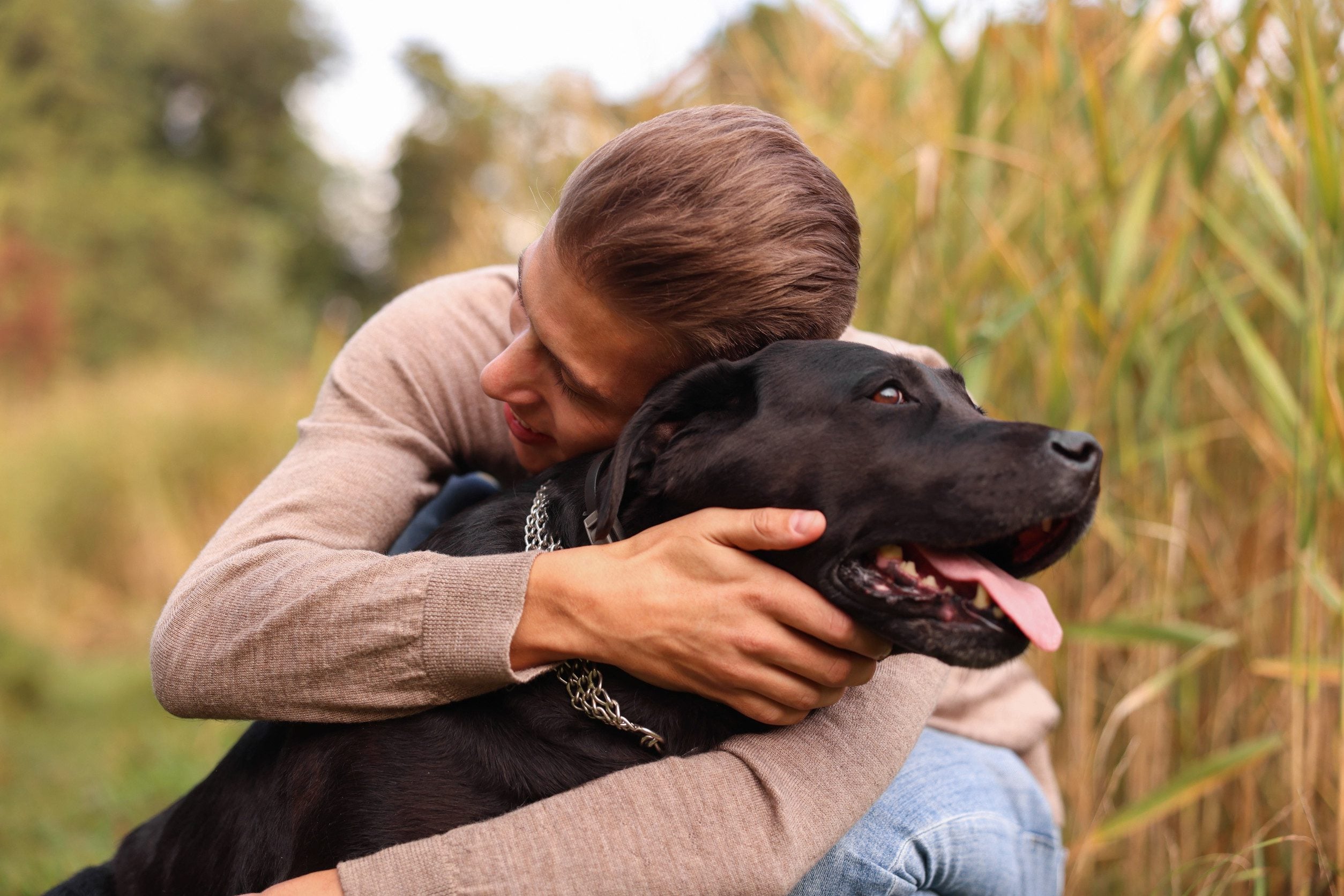 A man hugging his emotional support animal in Wilmington, DE.