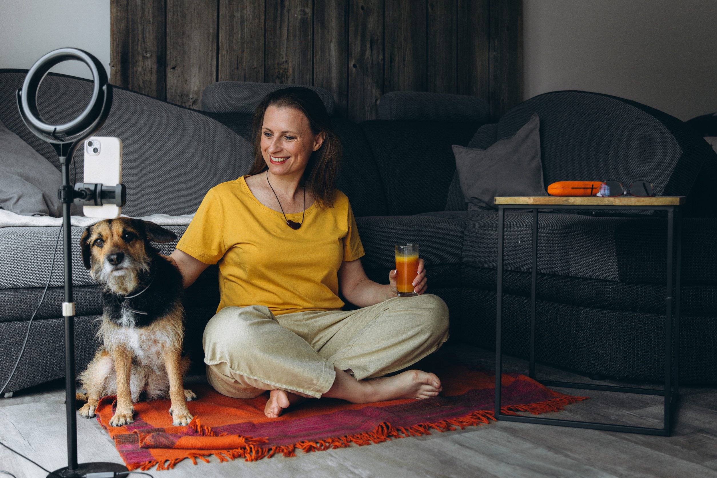 A woman sitting in her room with her emotional support animal in St. Petersburg, FL.