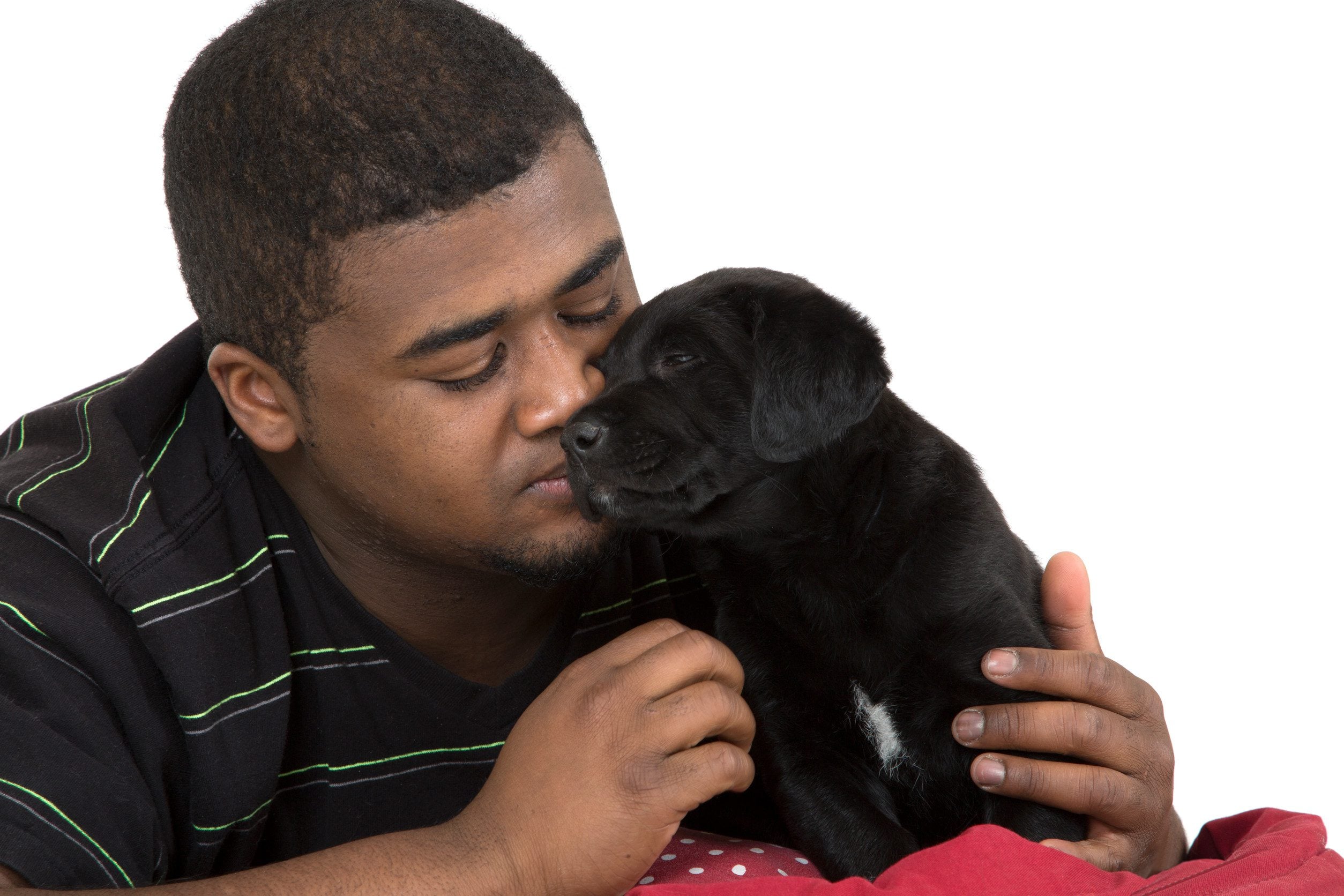 Man cozying up to his young emotional support animal.