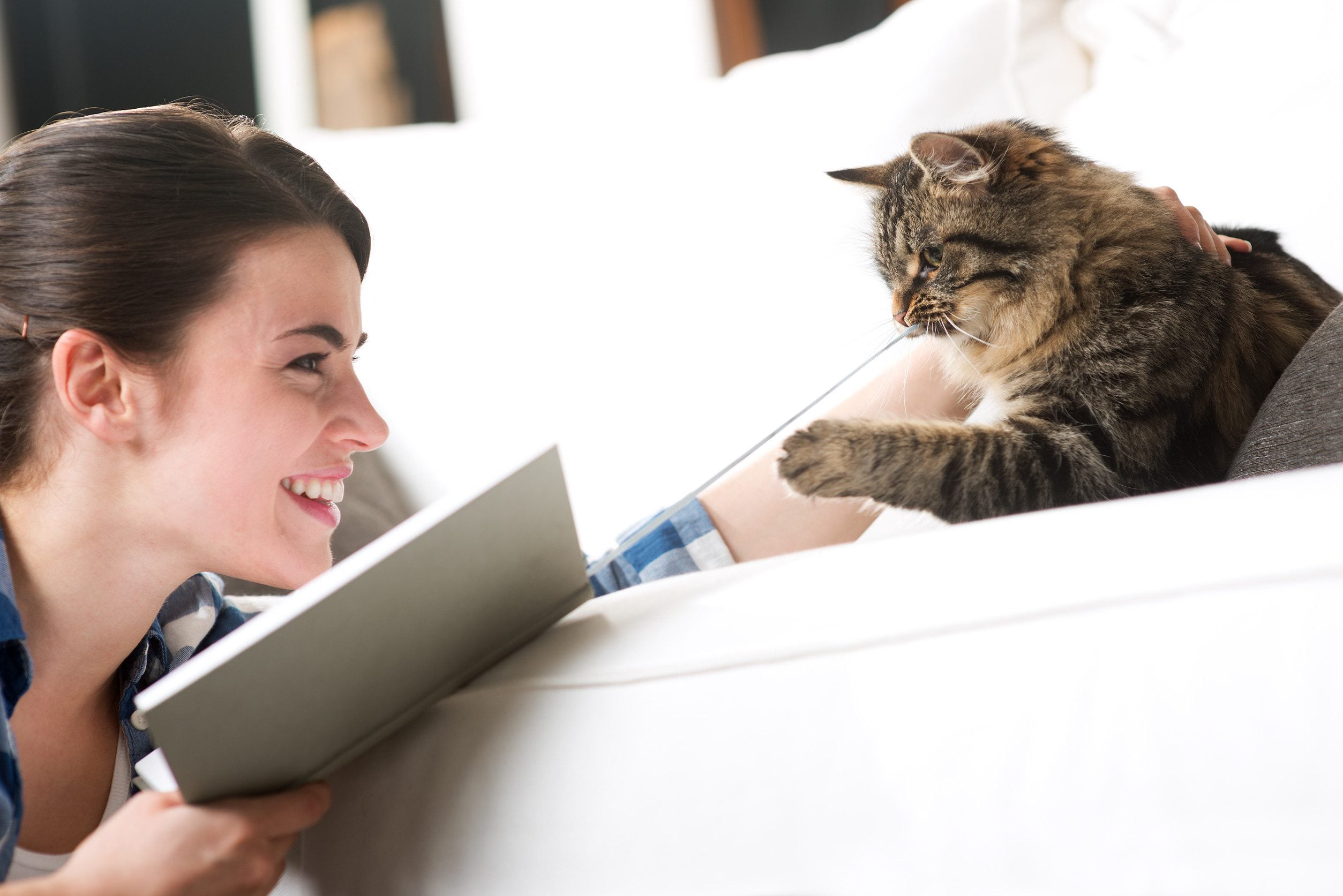 Woman looking up at emotional support cat.