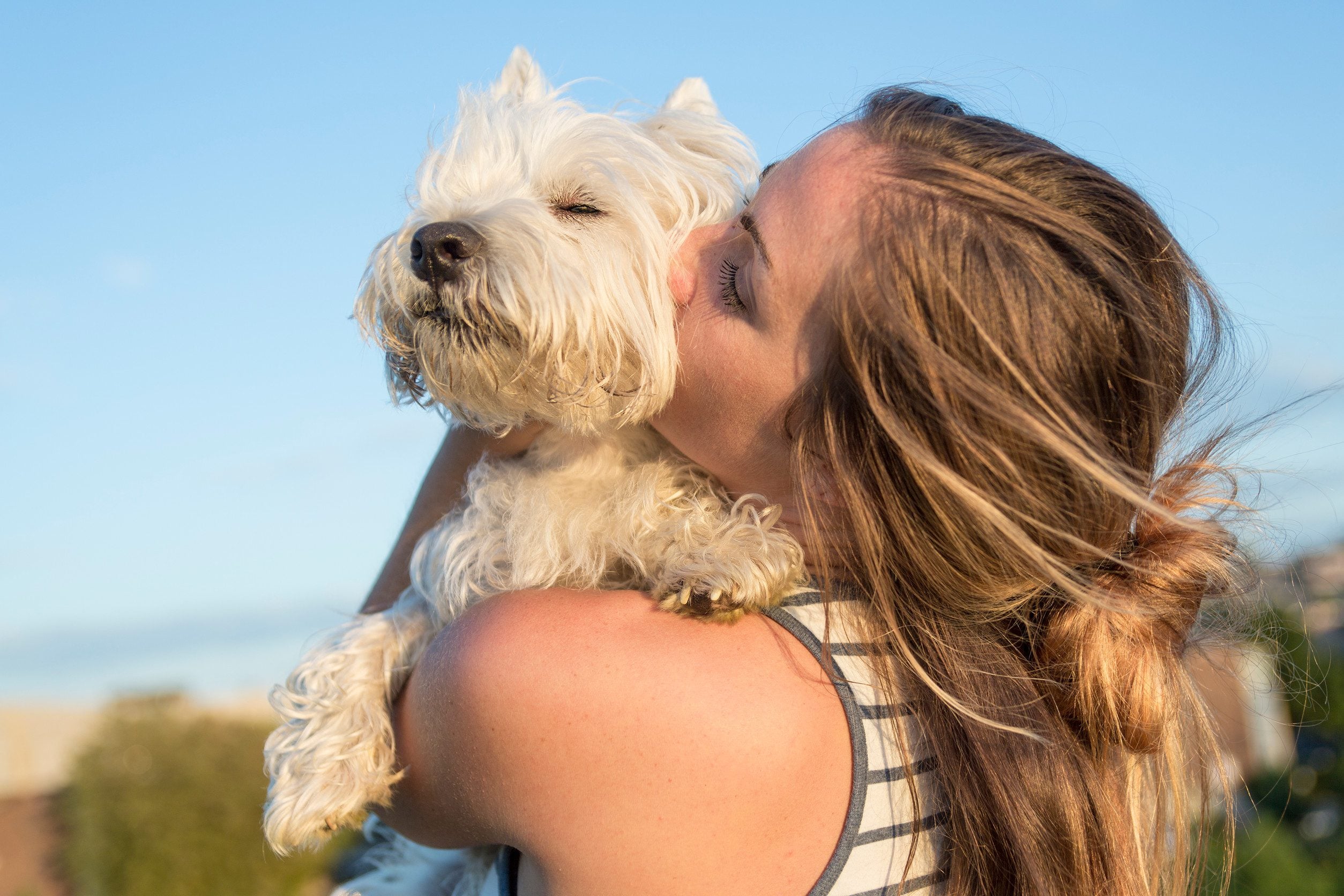 A woman kissing her emotional support animal in Wilmington, DE.
