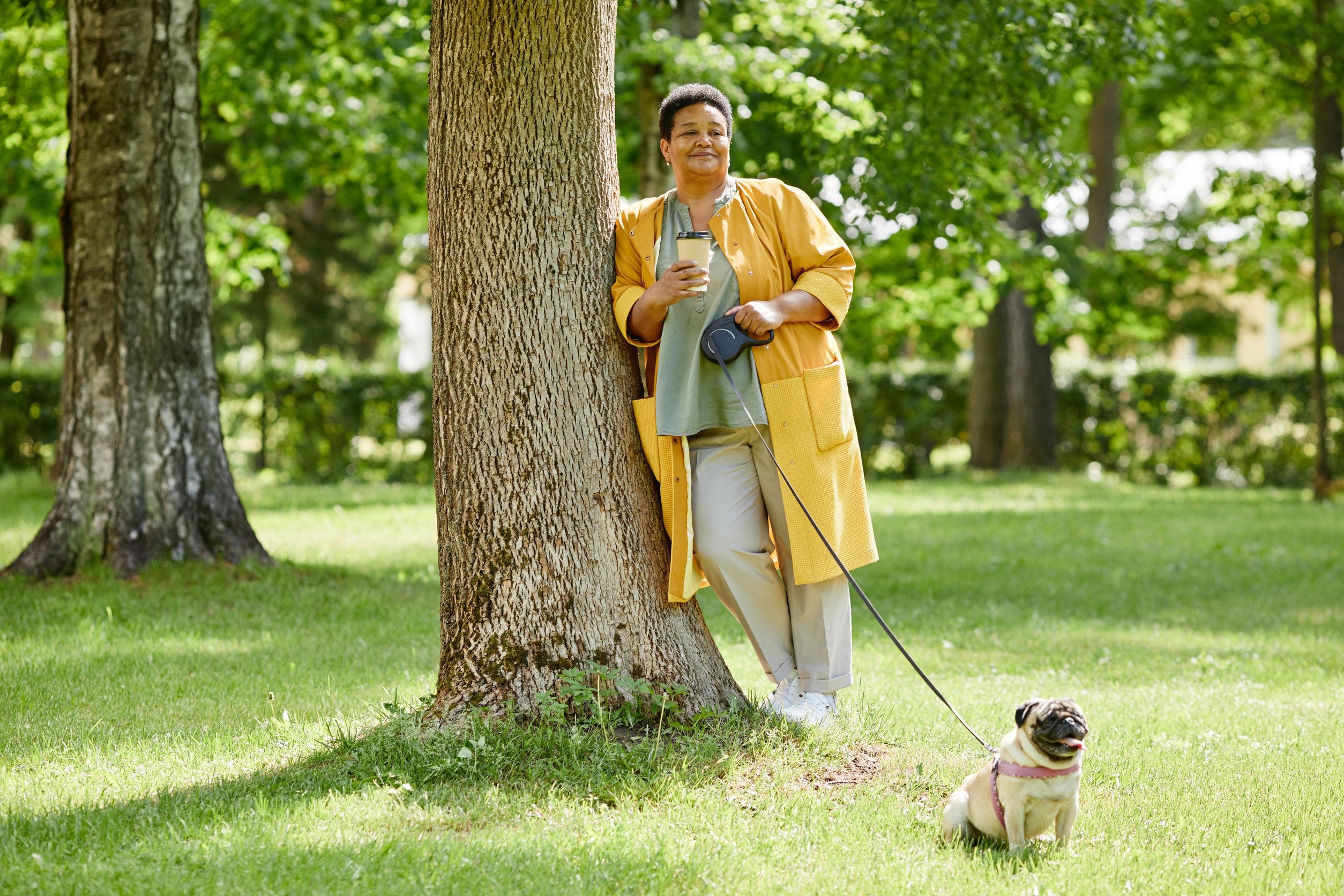 A woman spending time with her emotional support animal in a park in Fargo, ND.