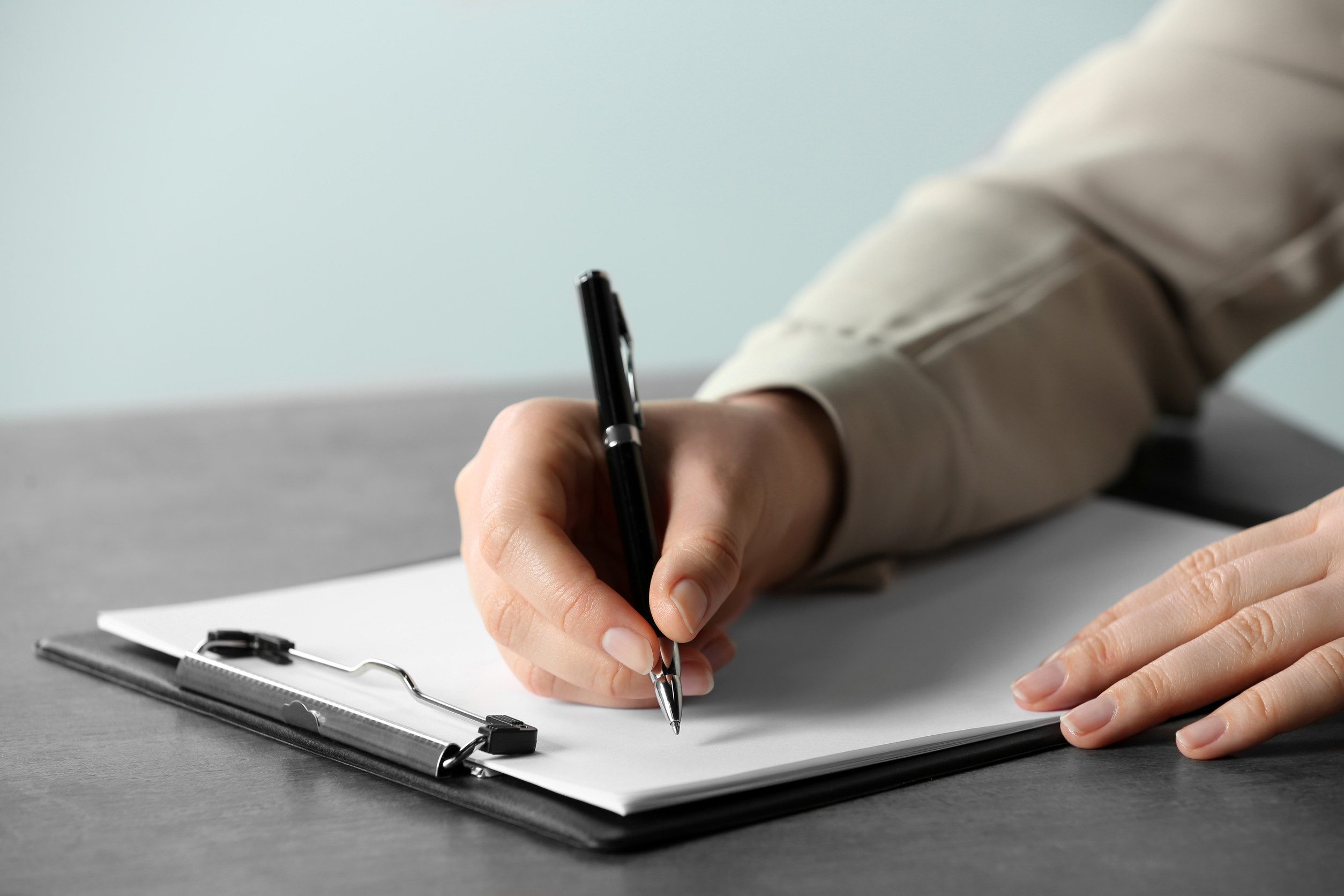 A close-up image of a therapist writing an ESA letter in Corpus Christi.