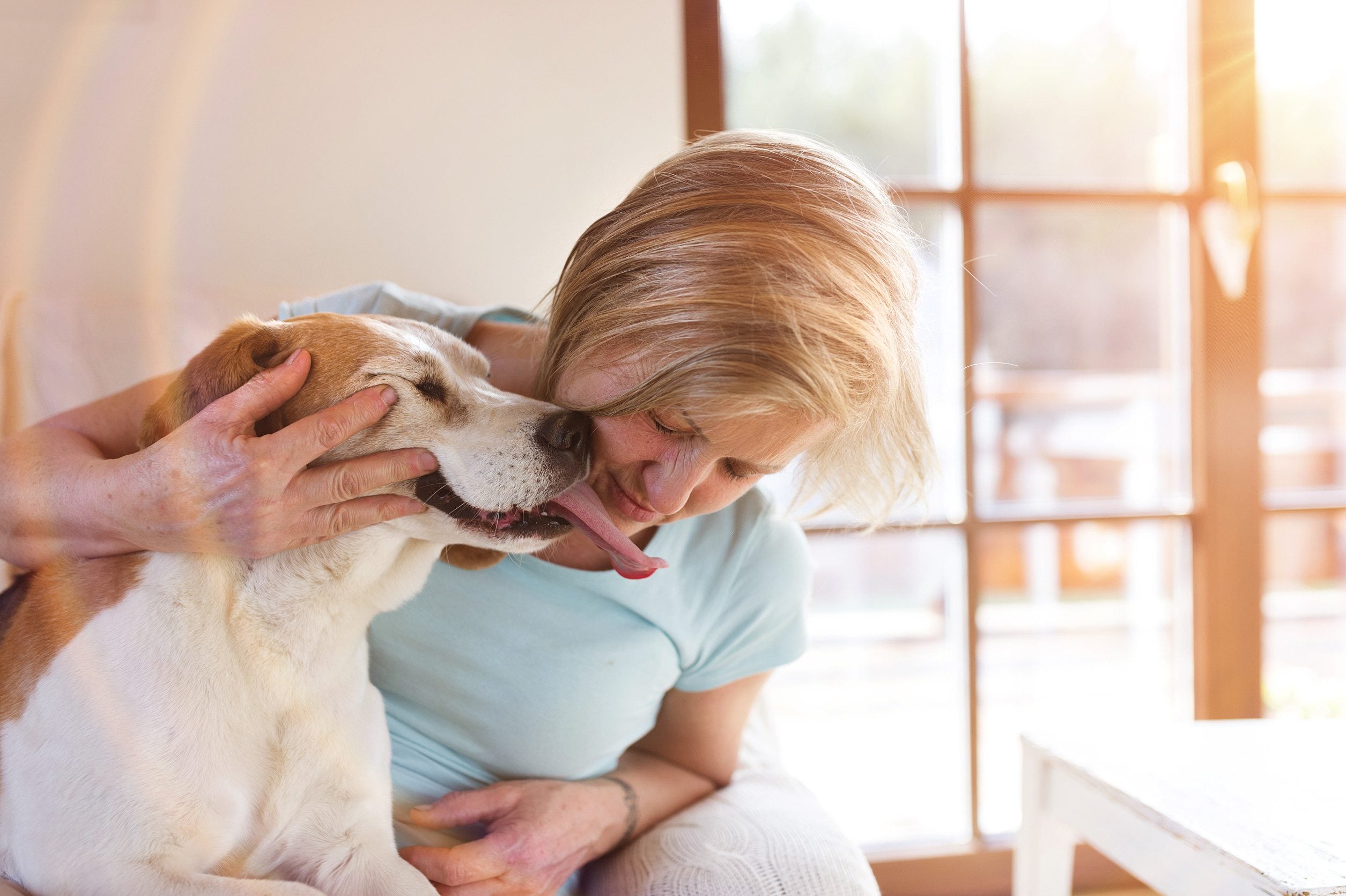 A woman hugging her emotional support animal in Buffalo, NY.